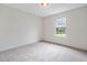 Bedroom featuring neutral carpet, bright window, and ample space at 87 Fair Havens Dr, Hiram, GA 30141