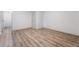 Cozy bedroom with neutral paint, light-colored wood-look flooring, and a door leading to the hallway at 87 Fair Havens Dr, Hiram, GA 30141