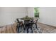 Stylish dining area featuring a unique table setting, modern chairs, and hardwood flooring adding a touch of elegance at 87 Fair Havens Dr, Hiram, GA 30141