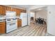 Kitchen and dining area, featuring wood cabinets and modern appliances at 87 Fair Havens Dr, Hiram, GA 30141