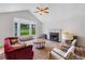 Bright living room with vaulted ceilings, fireplace, and large bay window offering serene outdoor views at 87 Fair Havens Dr, Hiram, GA 30141