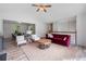 Open-concept living room with vaulted ceilings, hardwood floors, and seamless flow to adjacent dining area at 87 Fair Havens Dr, Hiram, GA 30141