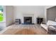 Cozy living room with hardwood floors, a fireplace, and neutral walls creating a warm and inviting atmosphere at 87 Fair Havens Dr, Hiram, GA 30141