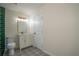 Bathroom featuring a white vanity, toilet, dark green shower, and patterned tile floor at 2524 Glenrock Dr, Decatur, GA 30032