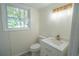 Updated bathroom features a new vanity with a modern faucet and stylish tile flooring at 2524 Glenrock Dr, Decatur, GA 30032