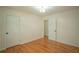 A modest bedroom featuring hardwood floors and two closets at 2524 Glenrock Dr, Decatur, GA 30032