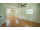 Spacious bedroom featuring hardwood floors, two ceiling fans, and natural light from two large windows at 2524 Glenrock Dr, Decatur, GA 30032