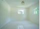 Bright bedroom with fresh paint, two windows, and neutral decor at 2524 Glenrock Dr, Decatur, GA 30032
