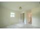 Bright bedroom with a new carpet, window and adjacent closet at 2524 Glenrock Dr, Decatur, GA 30032