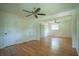 Bright bedroom showcasing hardwood floors, two closets, and two ceiling fans at 2524 Glenrock Dr, Decatur, GA 30032