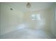 A bright and clean bedroom with a large window at 2524 Glenrock Dr, Decatur, GA 30032