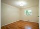 Cozy bedroom featuring hardwood floors, natural light, and a fresh coat of paint at 2524 Glenrock Dr, Decatur, GA 30032
