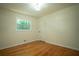 Comfortable bedroom with hardwood floors, a classic door, and ample natural light at 2524 Glenrock Dr, Decatur, GA 30032