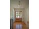 Inviting foyer with hardwood floors, glass front door, and stylish lighting fixture at 2524 Glenrock Dr, Decatur, GA 30032