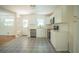 Updated kitchen features white cabinetry, stainless steel appliances, and stylish patterned flooring, creating a modern and functional space at 2524 Glenrock Dr, Decatur, GA 30032