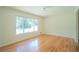 Bright and spacious living room with hardwood floors and a large window at 2524 Glenrock Dr, Decatur, GA 30032