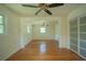 Open concept living area with hardwood floors, neutral paint, and lots of natural light at 2524 Glenrock Dr, Decatur, GA 30032