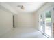 Spacious living room with new carpet and French doors leading to the outdoors at 2524 Glenrock Dr, Decatur, GA 30032