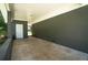 Covered patio with stained concrete floor, neutral painted brick, and recessed lights at 2524 Glenrock Dr, Decatur, GA 30032