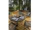 Outdoor back deck featuring a table setting with seating for outdoor dining at 4638 Villa Chase Ne Dr, Marietta, GA 30068