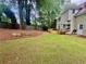 Backyard featuring a lush lawn, wooden fence, and a wooden deck for outdoor enjoyment at 4638 Villa Chase Ne Dr, Marietta, GA 30068
