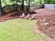 Landscaped backyard with three chairs at 4638 Villa Chase Ne Dr, Marietta, GA 30068