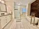 Bathroom featuring double sink vanity, a glass shower and a soaking tub with wood accent wall at 4638 Villa Chase Ne Dr, Marietta, GA 30068