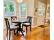 Cozy breakfast nook offers lots of natural light from windows overlooking lush backyard greenery at 4638 Villa Chase Ne Dr, Marietta, GA 30068