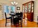 Classic dining room with a traditional china cabinet and a chandelier for warm lighting at 4638 Villa Chase Ne Dr, Marietta, GA 30068
