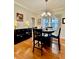 Elegant dining area featuring a chandelier and table set for dinner underneath a picture window at 4638 Villa Chase Ne Dr, Marietta, GA 30068