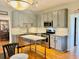Modern kitchen featuring stainless steel appliances, subway tile backsplash, and a convenient island at 4638 Villa Chase Ne Dr, Marietta, GA 30068