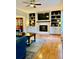 Cozy living room featuring a fireplace with built-in shelving and cabinets for storage and display at 4638 Villa Chase Ne Dr, Marietta, GA 30068
