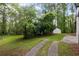 Picturesque backyard with shed and concrete pathway at 5414 Iris Sw Dr, Mableton, GA 30126