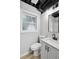 Modern basement bathroom with gray walls, wood-look flooring and contemporary fixtures at 5414 Iris Sw Dr, Mableton, GA 30126
