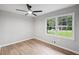 This bedroom has new floors, a ceiling fan and natural light at 5414 Iris Sw Dr, Mableton, GA 30126