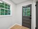 Mudroom area with tile flooring, window and a gray door at 5414 Iris Sw Dr, Mableton, GA 30126
