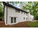 Back of a white painted brick home with black trim and double door access at 5414 Iris Sw Dr, Mableton, GA 30126