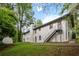 Back of the house with white brick exterior and an external stair case at 5414 Iris Sw Dr, Mableton, GA 30126