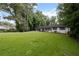 Attractive home featuring a lush lawn and mature trees offering privacy at 5414 Iris Sw Dr, Mableton, GA 30126