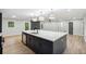Spacious kitchen features island, stainless steel appliances, and updated finishes at 5414 Iris Sw Dr, Mableton, GA 30126