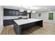 Island kitchen with stainless steel appliances and quartz countertops at 5414 Iris Sw Dr, Mableton, GA 30126