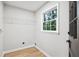 Laundry room featuring a window, wire shelf and light gray walls at 5414 Iris Sw Dr, Mableton, GA 30126