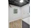 Laundry area in finished basement area with gray walls, wood-look floors, and modern accents at 5414 Iris Sw Dr, Mableton, GA 30126
