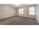 Spacious bedroom with ample closet space and neutral walls, creating a serene retreat at 5618 Stonington Trace Pkwy, Stone Mountain, GA 30087