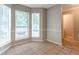 Bright dining area bathed in natural light, featuring a large window and neutral decor at 5618 Stonington Trace Pkwy, Stone Mountain, GA 30087