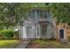 Charming townhome featuring blue shutters and well-maintained landscaping in a desirable neighborhood at 5618 Stonington Trace Pkwy, Stone Mountain, GA 30087