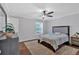 Serene bedroom with hardwood floors, ceiling fan, and ample natural light at 1261 Lavista Ne Rd # E-8, Atlanta, GA 30324