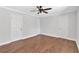 Spacious bedroom with hardwood floors, neutral walls, and modern ceiling fan at 1261 Lavista Ne Rd # E-8, Atlanta, GA 30324