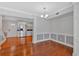 Charming dining room with hardwood floors and classic wainscoting leading to the kitchen at 1261 Lavista Ne Rd # E-8, Atlanta, GA 30324