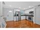 Modern kitchen featuring stainless steel appliances, white cabinets, and hardwood floors at 1261 Lavista Ne Rd # E-8, Atlanta, GA 30324